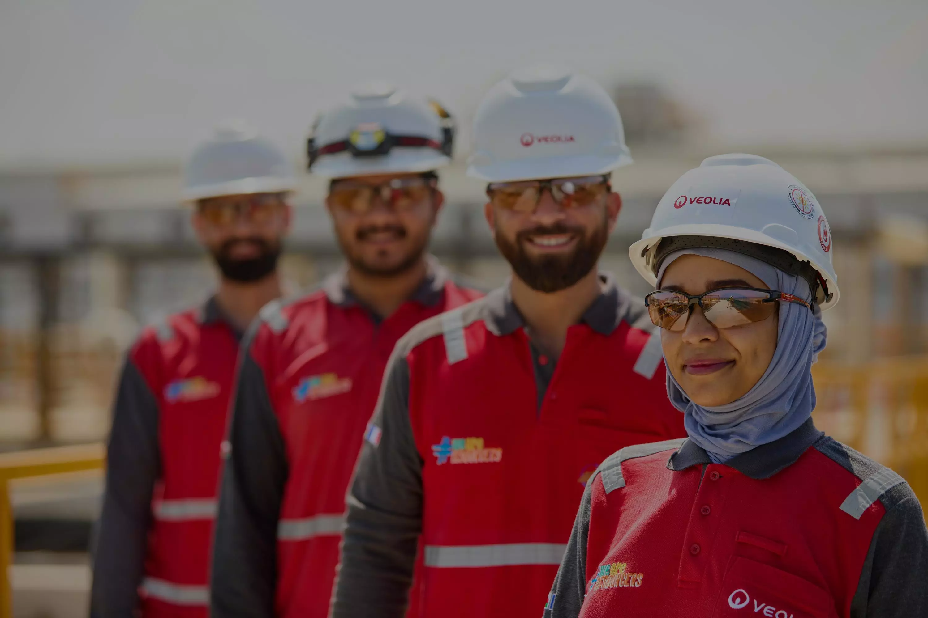 Group pictures of employees in a desalination plant in Oman