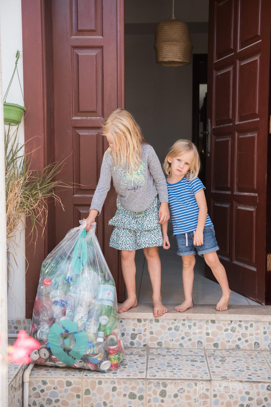 collection at doors of plastics bottles and cans with recaps app